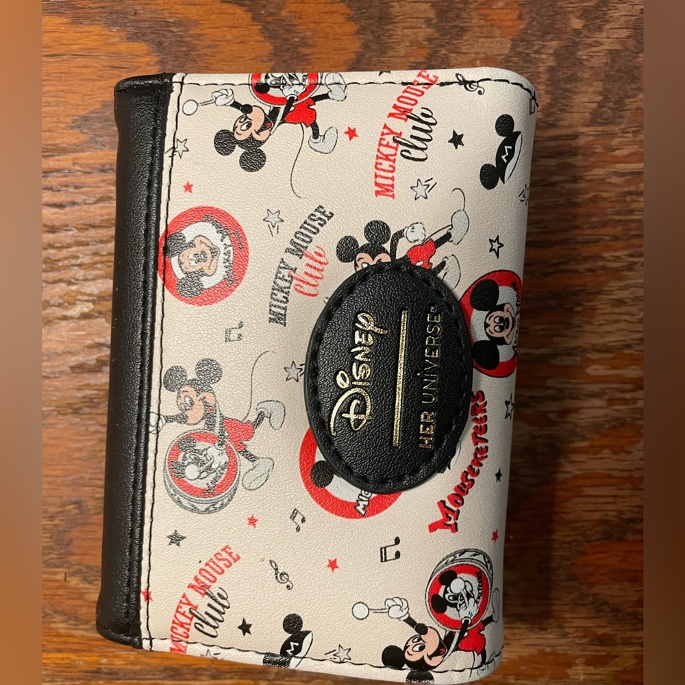 Her Universe Mickey trifold wallet.  Practically new!  Only used for a 2 weeks.